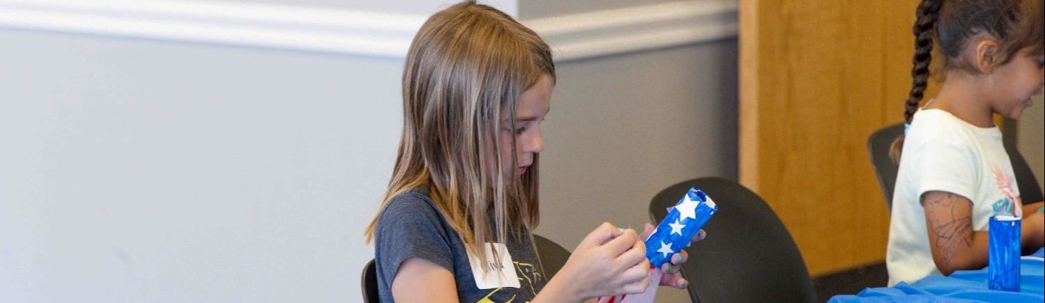 A girl assembling a craft